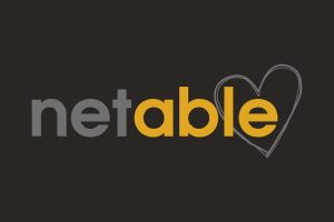 Logo von Netable Logo von Netable in Grau und Gelb mit einem Herzsymbol.
